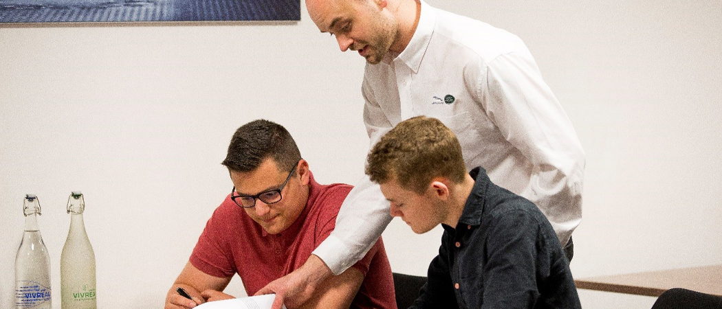 trainer with apprentices in classroom